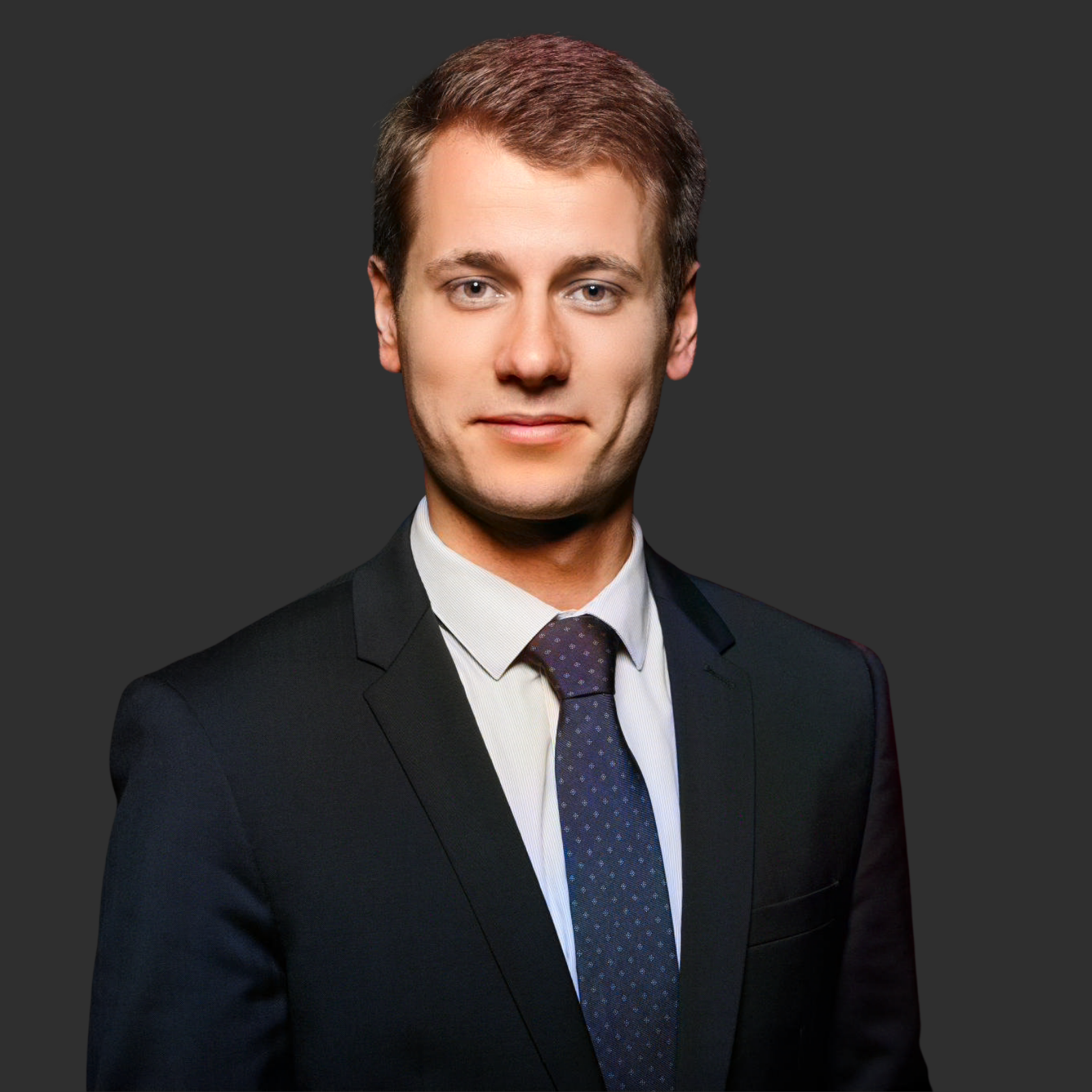 Porträt von Igor Didelot, Of Counsel bei JBV & Partners, mit neutralem, freundlichem Gesichtsausdruck vor einem grauen Hintergrund